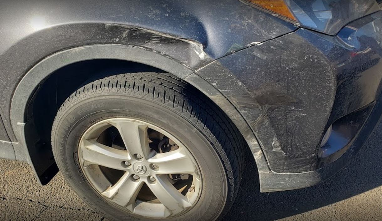 Damaged car after a collision on a Connecticut road